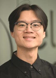 Portrait of a young man smiling.