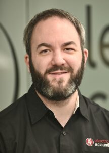 Man with a beard smiling