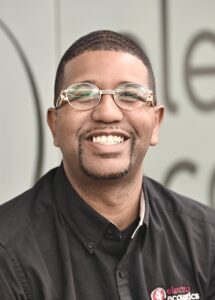 man with glasses smiling