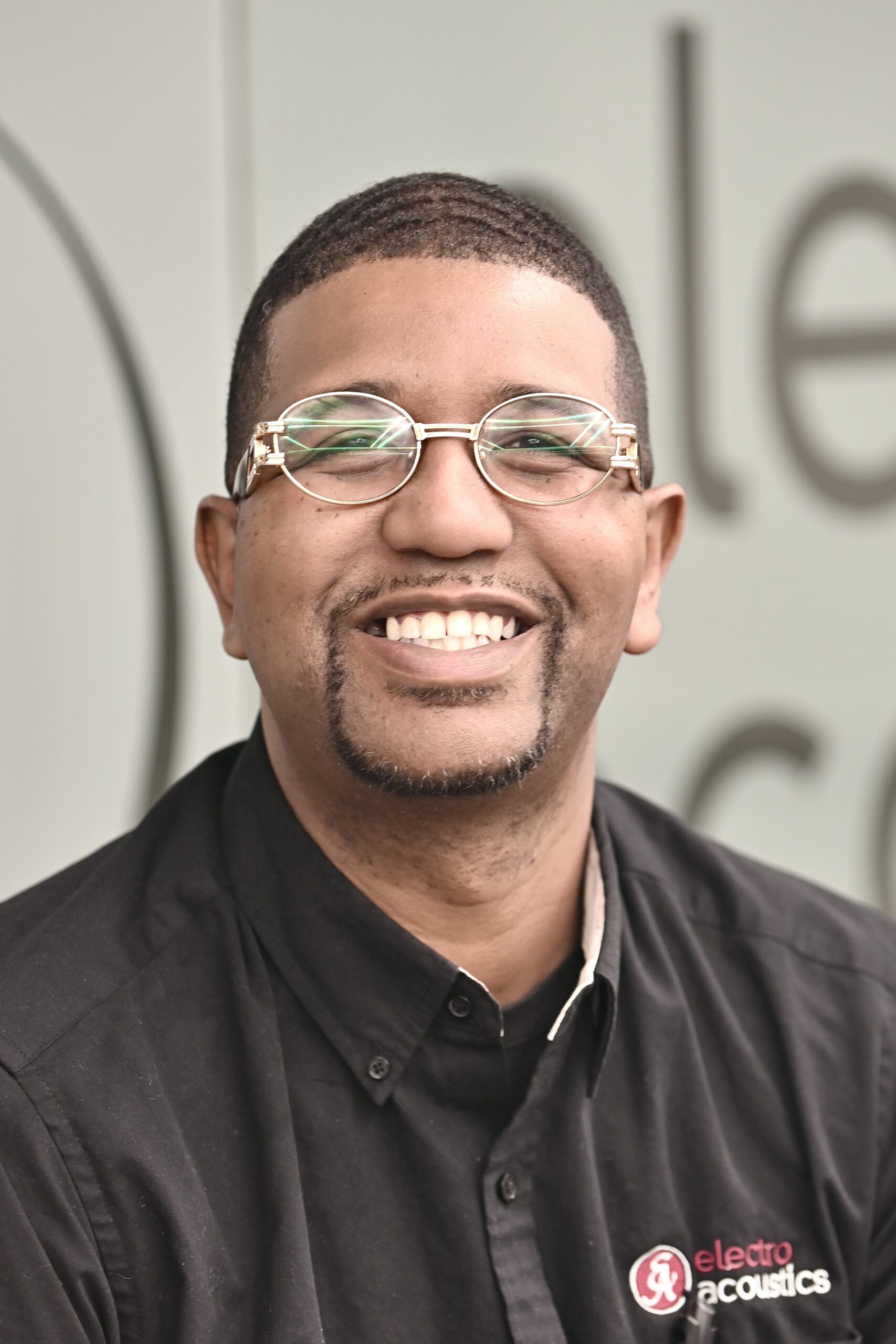 man with glasses smiling